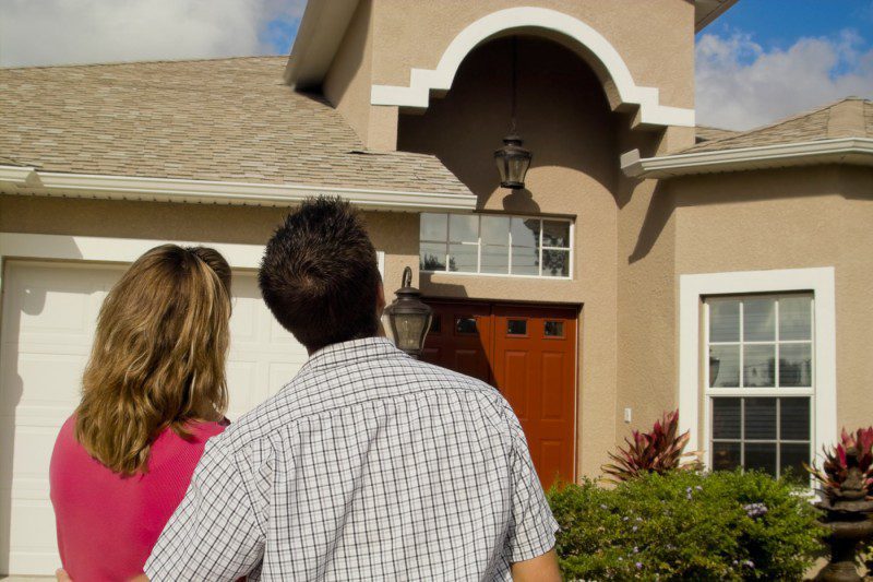Homeowners looking a new house and roof